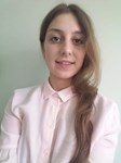 Laura E.
